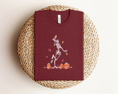 Dancing Skeleton And Pumpkins Shirt, Halloween Themed Shirt for Her, Funny Skeleton T-Shirt, Pumpkin Lover Gift, Unisex Crewneck and V-neck